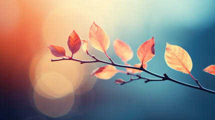 Enchanting Leaves: Closeup of Vibrant Colorful Leaves on Branch with Soft Blue and Pink Hues