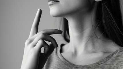 Woman making hand gesture like bird on light background, closeup with space for text. Black and white effect