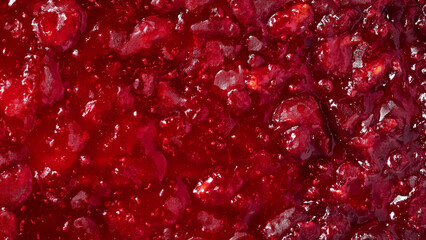 Texture: raspberry jam, food theme background. Freshly made strawberry jam texture