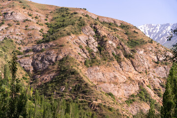 A mountain with a rocky, barren hillside