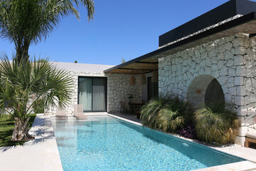 Tranquil image of an empty pool in the backyard of a country house on a beautiful sunny day. Close...
