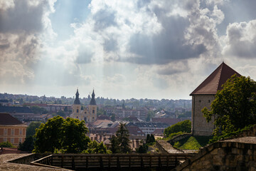 Orange red tiled roof of the houses in Eger. Details of different buildings in Hungry. Medieval old...