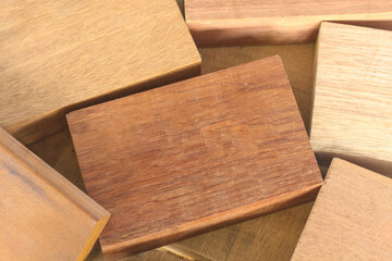 Pile of cut wooden blocks and planks, wood material