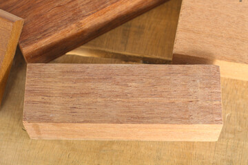 Pile of cut wooden blocks and planks, wood material
