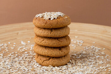 A stack of oatmeal cookies on a wooden stand. Healthy dietary oatmeal cookies. Horizontal..