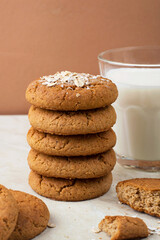 A stack of oatmeal cookies and a glass of milk. Healthy dietary oatmeal cookies.