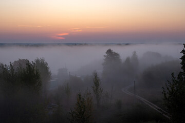 Obraz premium Beautiful foggy morning, mystical and mesmerizing landscape
