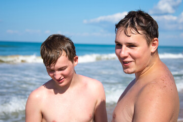 Fototapeta premium Summer and vacation. Close friends are relaxing at sea.
