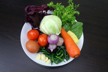 Farm-Fresh Vegetables and Essential Spices on Dark Wood Tabletop