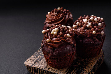 Delicious fresh muffins with filling and chocolate coating