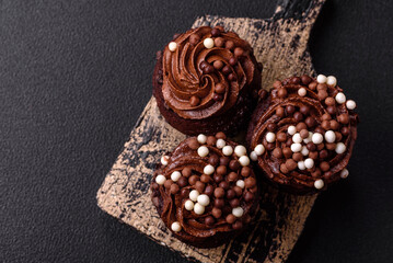 Delicious fresh muffins with filling and chocolate coating