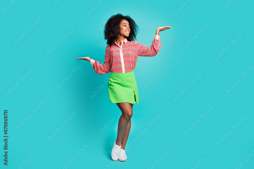 Wall mural full length photo of cheerful pretty lady dressed print blouse showing arms scales empty space isola