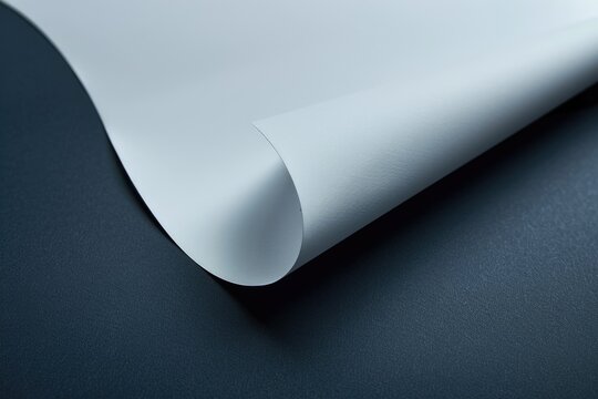 Close-up shot of a sheet of paper sitting on a table, with no additional context