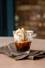Vanilla ice cream with coffee in a glass. Summer cold drink.