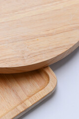 brown wooden tray and sphere cuttingboard isolated on white background