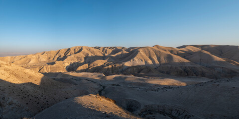 Beautiful Panoramic View of Dry Sandstones Mountain Ranges and Valleys Seen From Afar near the Dead Sea at Sunset