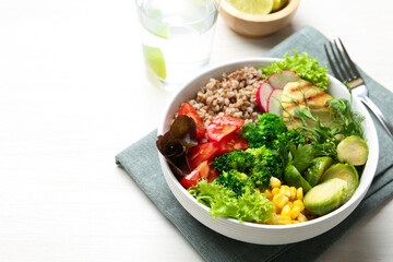 Healthy meal. Tasty products in bowl on white table, space for text
