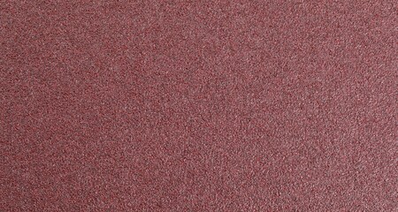 Texture of coarse sandpaper as background, top view