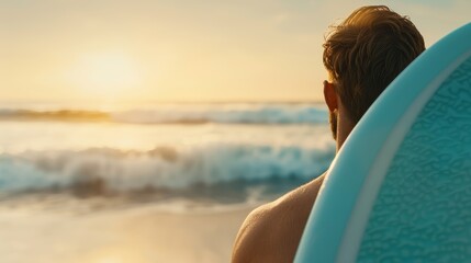 Fototapeta premium A surfer with a blue board underarm, staring at the approaching waves, tranquil beach atmosphere, soft golden light of early morning