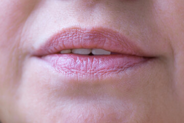 Fototapeta premium close up lips of mature female face, happy 50-year-old woman with gentle smile, Anti-aging Procedures in mature age concept, Women's Health and Self-Esteem