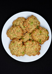 Sweet oatmeal cookies with filling on a white plate. A sweet breakfast.
