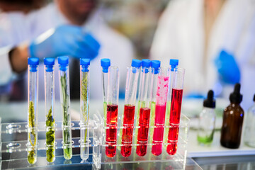 scientific tubes containing rare chemicals and exotic plant samples are used to extract substances for developing advanced medicines. scientist meticulously prepares for groundbreaking experiment.