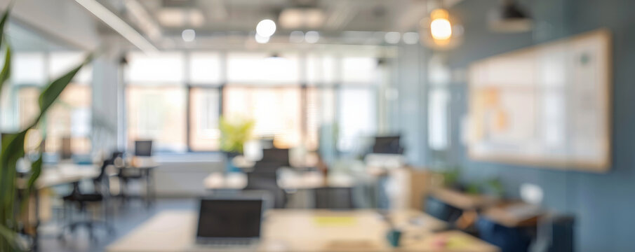 A blurred bright office background with collaborative spaces, whiteboards, and modern furniture, suggesting a creative and open work atmosphere.