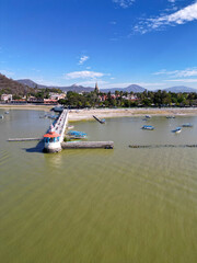 Fototapeta premium Vertical view of the lighthouse located on the pier of Lake Chapala, Jalisco