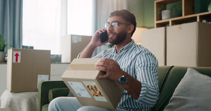 Man, phone call and box in warehouse for delivery schedule, ecommerce and inquiry for order. Indian entrepreneur guy, package and mobile hello for courier discussion, logistics and online shopping