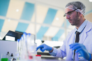 esteemed scientist man elegantly dressed in lab coats are meticulously testing chemicals innovative...