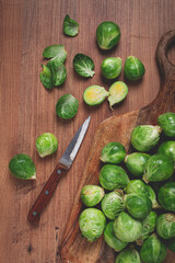 fresh Brussels sprouts, raw, top view, on a wooden table, no people,