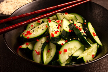 Chinese salad, cucumbers with chili pepper and sesame seeds, homemade, no people,