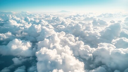 Breathtaking aerial view of fluffy white clouds in the bright sky.