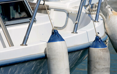 Fenders on a pleasure motorboat 
