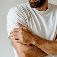 Fototapeta premium Man with crossed arms in white shirt beard strong confident attitude folded muscular arms concept