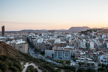 Evening View of Alicante City From a Hilltop Overlooking Buildings and Mountains