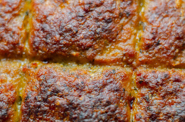 A piece of meat is cooked and has a crispy crust