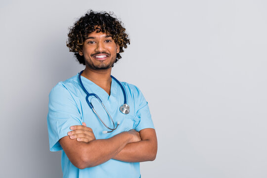 Photo of doctor guy cross arms smiling isolated grey color background