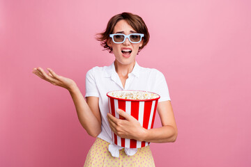 Photo of disappointed girl dressed white shirt in 3d glasses popcorn in hand read spoiler in...