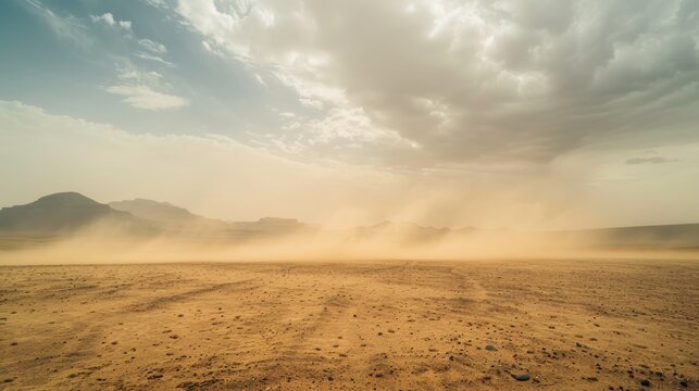 Vast desert wasteland  wide angle view of dusty sandstorm sweeping across arid landscape
