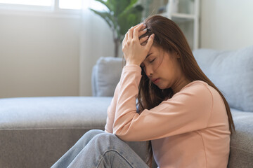 Sad, unhappy. Alone asian young woman, girl hand cover face thinking about problem, difficulty, feeling failure and exhausted, suffering from loneliness, grief sorrow and bad relationship or break up.