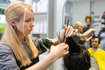 Hair stylist sectioning hair for precision cut