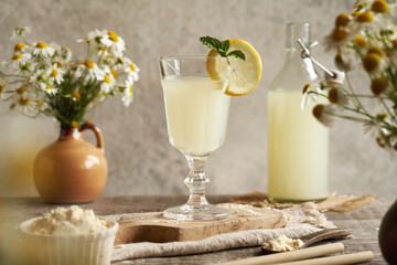 Fresh natural whey in a glass and whey powder