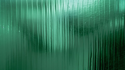 macro photography of green glass with vertical lines
