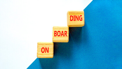 Onboarding success symbol. Concept word Onboarding on wooden blocks. Beautiful blue and white background. Business onboarding success concept. Copy space.