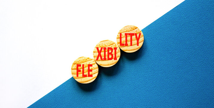 Flexibility symbol. Concept word Flexibility on beautiful wooden circles. Beautiful blue white background. Business flexibility concept. Copy space.