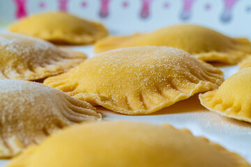 Hand made Ravioli noodles in close up view with soft bokeh background