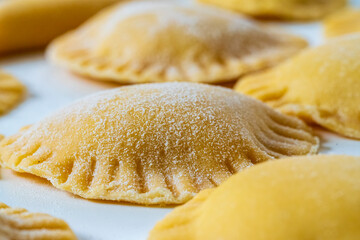 Hand made Ravioli noodles in close up view with soft bokeh background