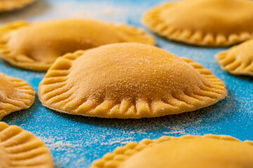 Hand made Ravioli noodles in close up view with soft bokeh background