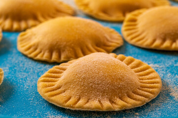 Hand made Ravioli noodles in close up view with soft bokeh background